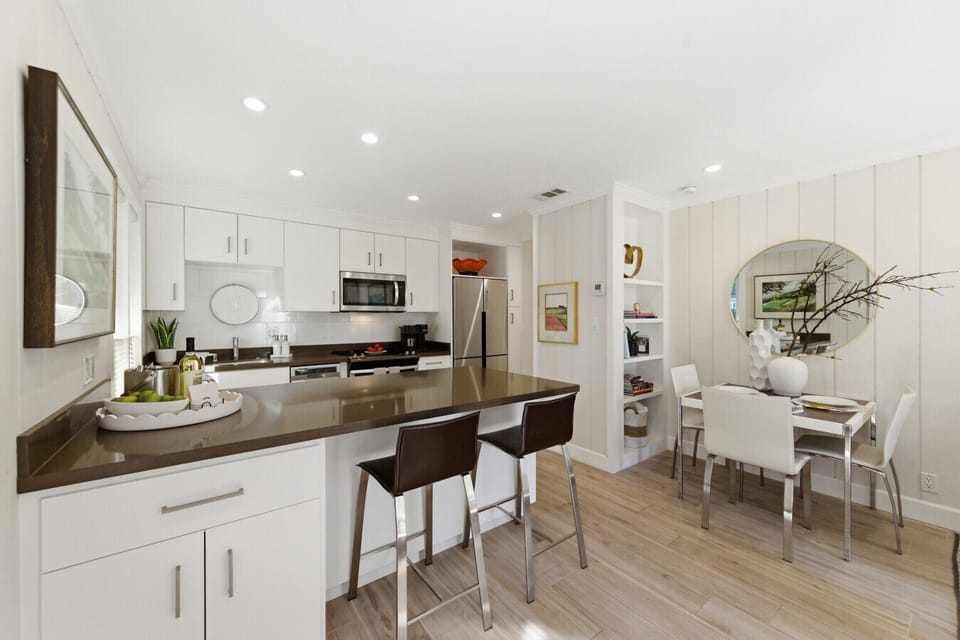 Fully equipped kitchen with bar seating and dining area — perfect for enjoying breakfast before wine tasting or relaxing dinners during your Napa Valley getaway.