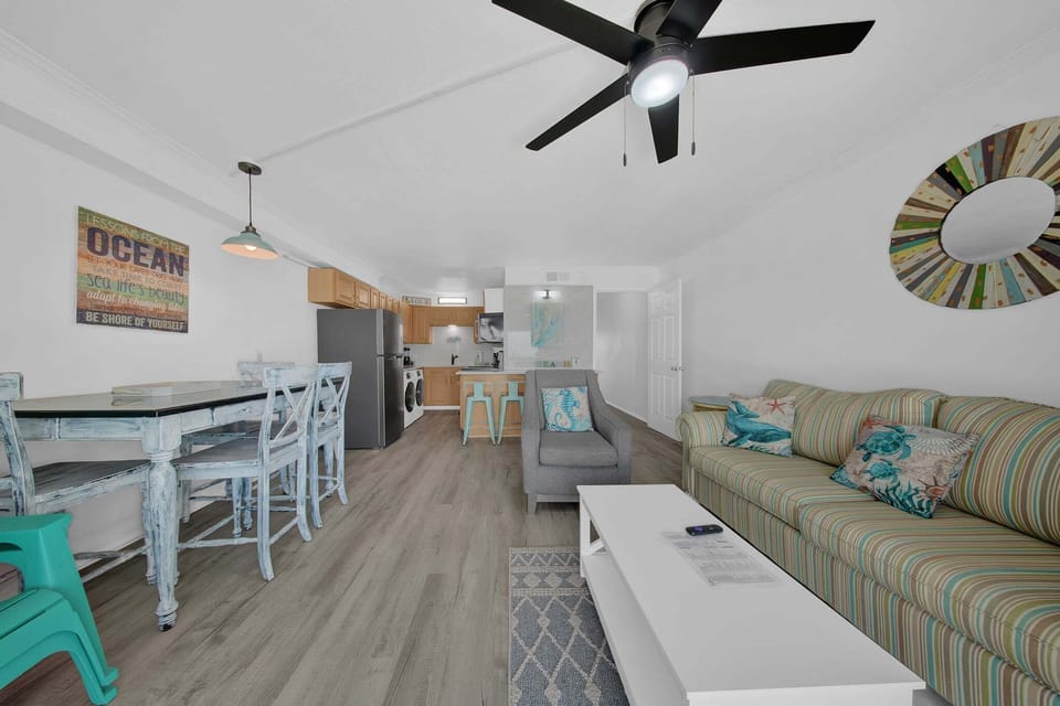 The layout creates a bright, inviting space ideal for gathering, unwinding, and enjoying the coastal scenery.