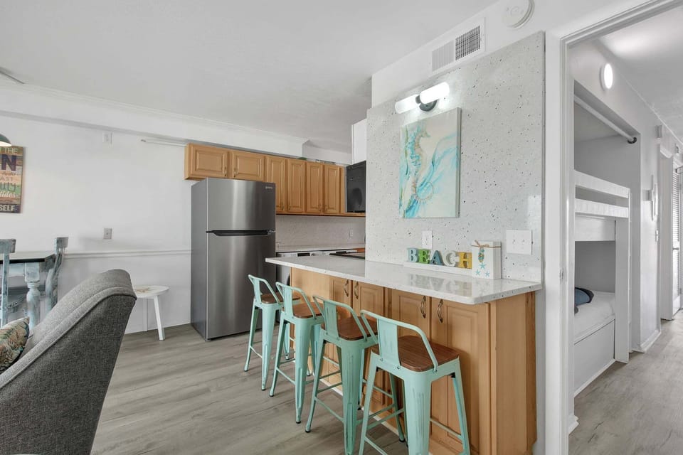 The counter bar offers additional seating and a convenient spot for casual meals or conversation.