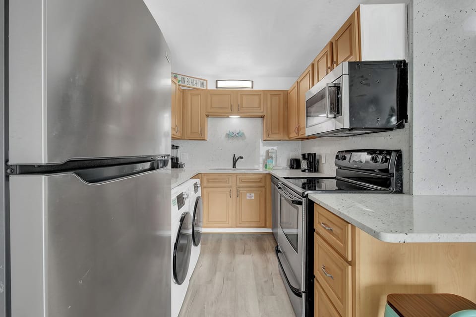 Its open layout keeps everyone connected to the living and dining areas while meals come together.