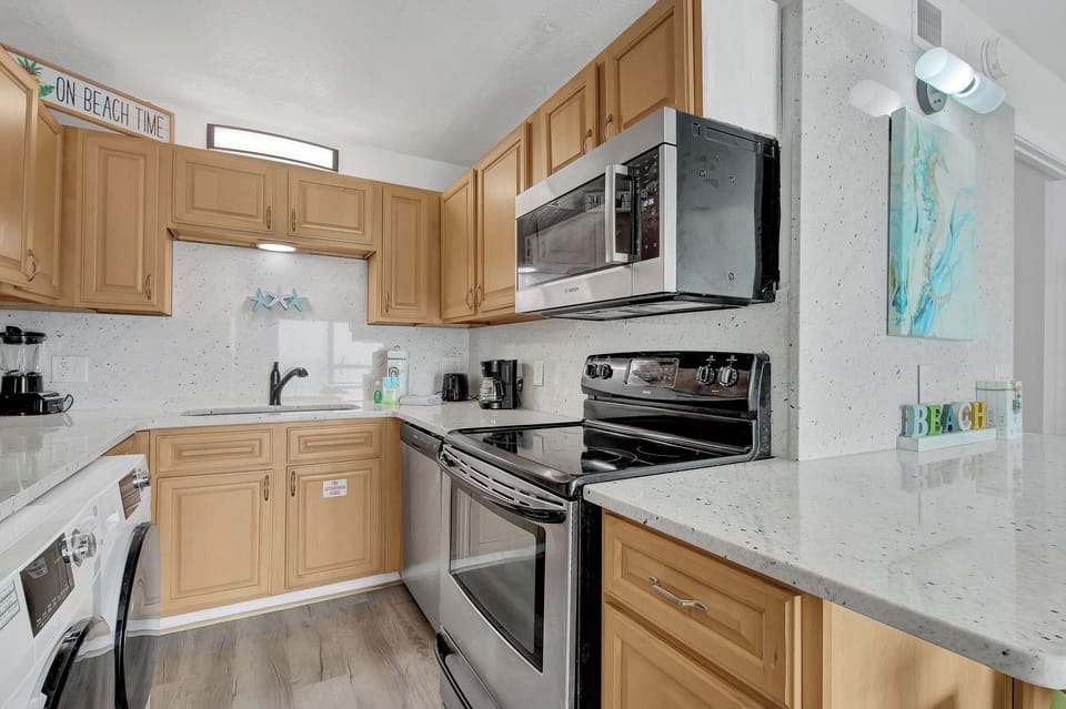 Modern appliances and ample counter space make cooking feel effortless.