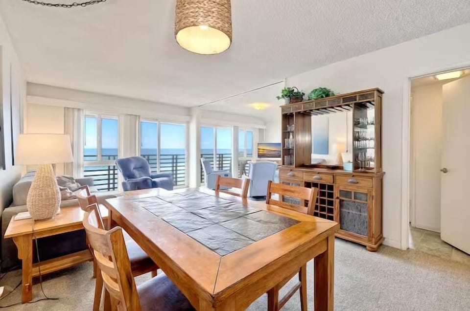 Chic dining space perfect for meals with family or friends, just steps from the ocean breeze.