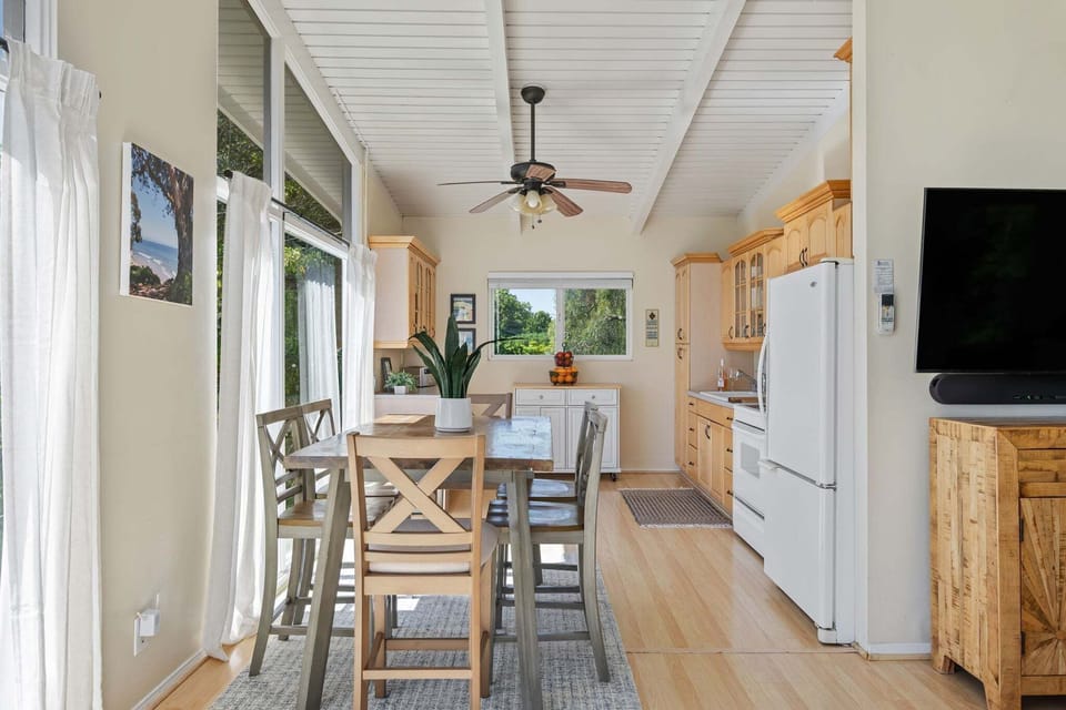 Dining table with views through the window and seating for 6