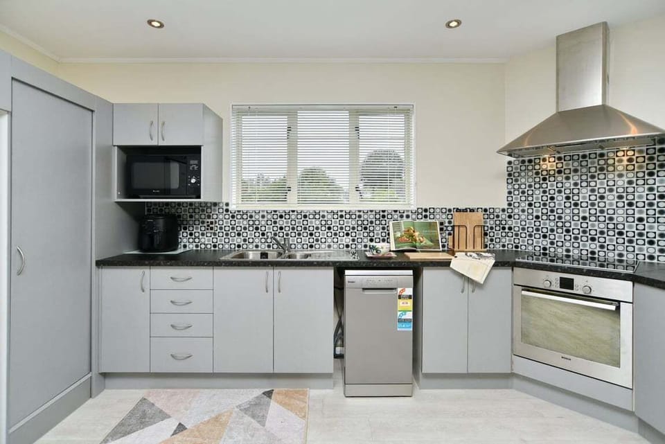 Modern kitchen with generous bench space and full cooking facilities