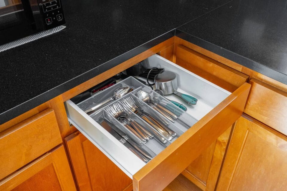 Fully stocked utensil drawer — everything you need to cook a proper meal is right at hand.