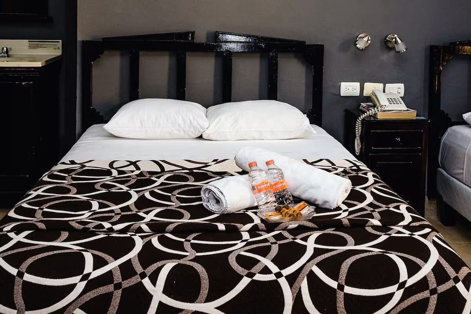 Sink into plush pillows with thoughtful welcome amenities waiting.
