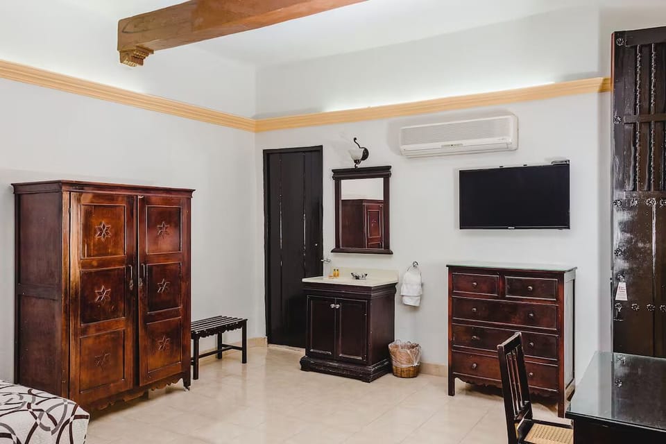 Refresh easily with in-room vanity, storage, and flat-screen TV.
