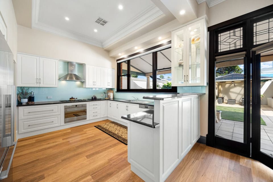 The spacious kitchen is thoughtfully designed for family cooking, with generous bench space and quality appliances.