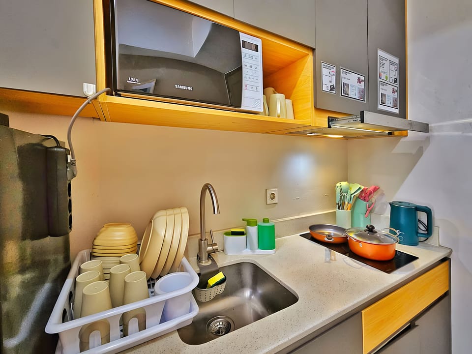 Mini-fridge, microwave, stovetop, cookware/dishes/utensils