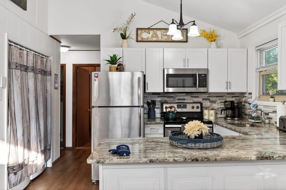 Designer kitchen featuring premium granite and stainless steel finishes.