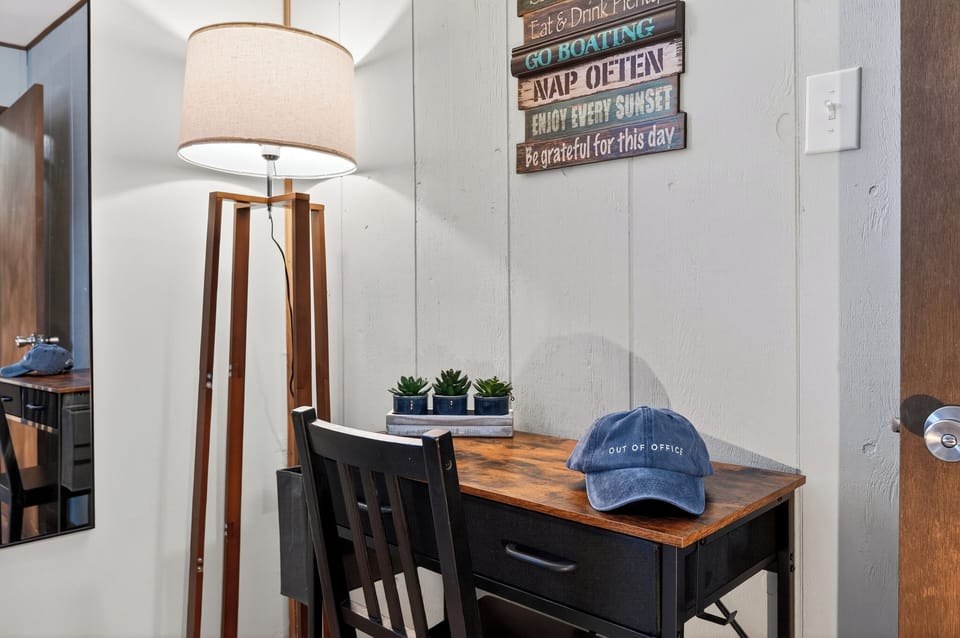 Close-up of the dedicated workspace with a vintage-style lamp.