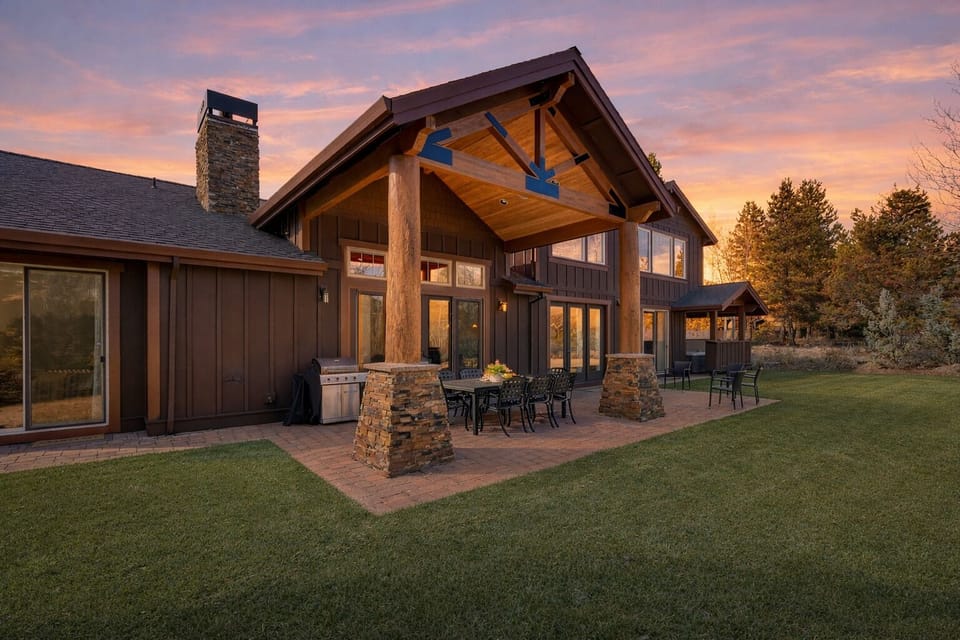 Golden-hour magic at the lodge—gather under the covered patio, fire up the grill, and unwind beneath a sunset sky.