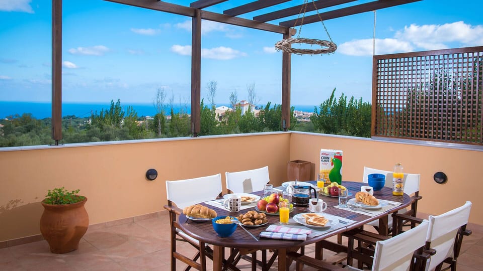 Spacious balcony with sitting area and sea view