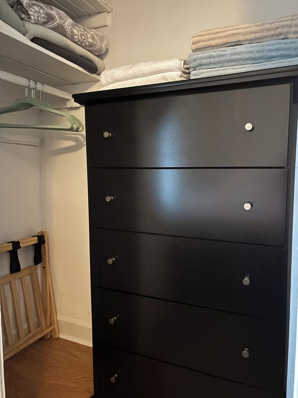 Queen bedroom closet with storage