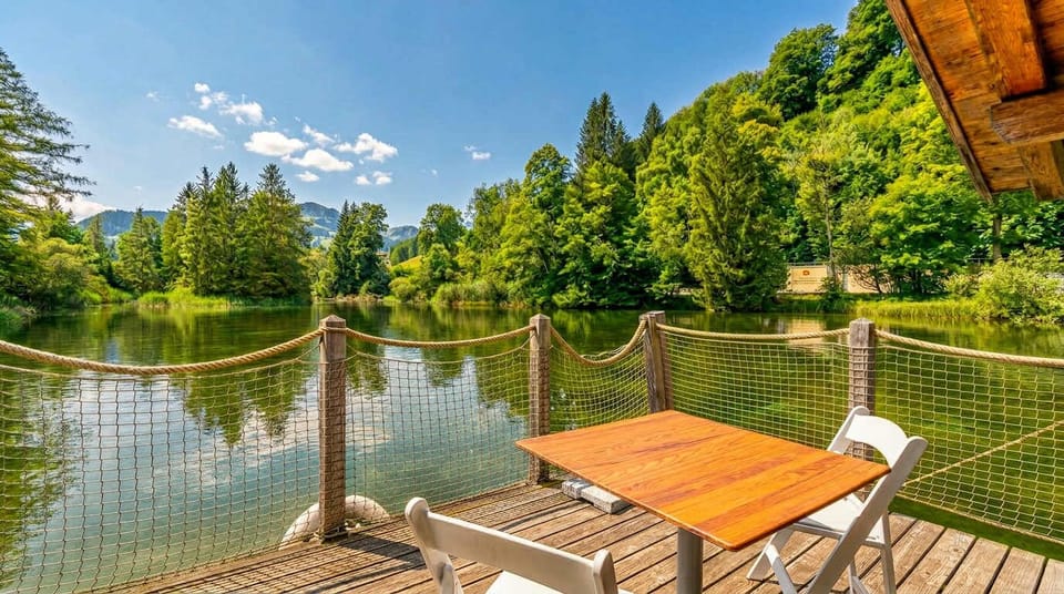 Private terrace directly above the lake with seating and scenic views