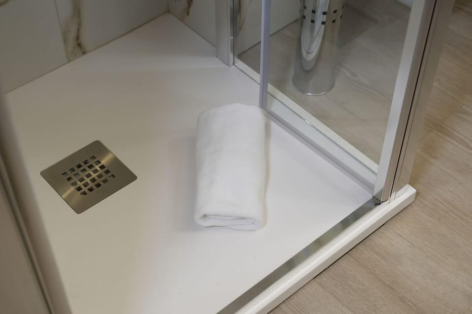 Comfort Townhome, Courtyard View, Courtyard Area | Bathroom amenities | Shower, hair dryer, towels, soap