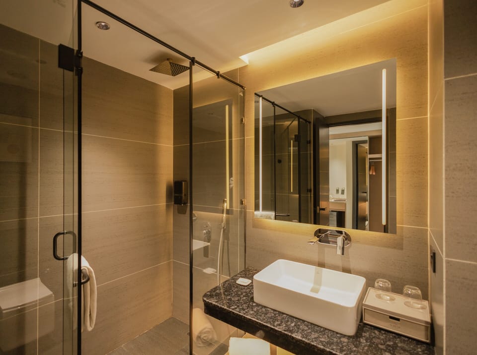 Shower, hair dryer, slippers, towels