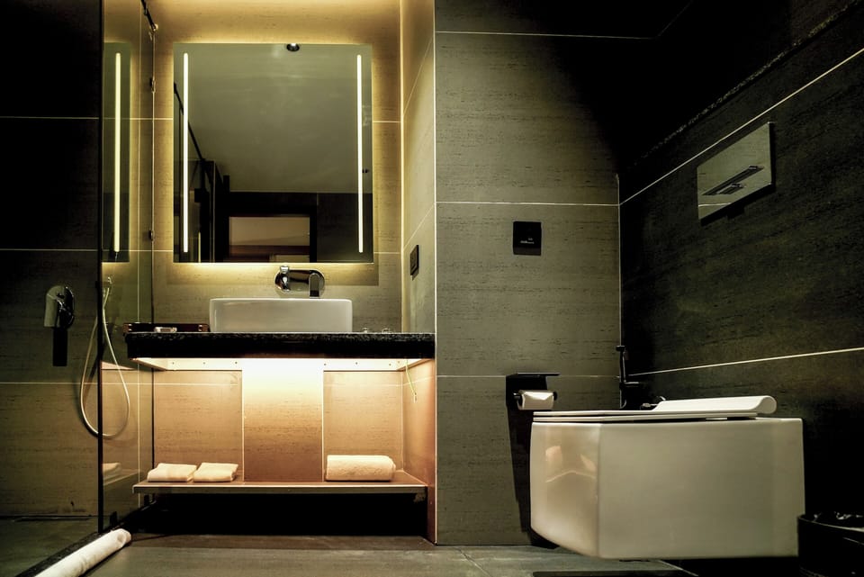 Shower, hair dryer, slippers, towels