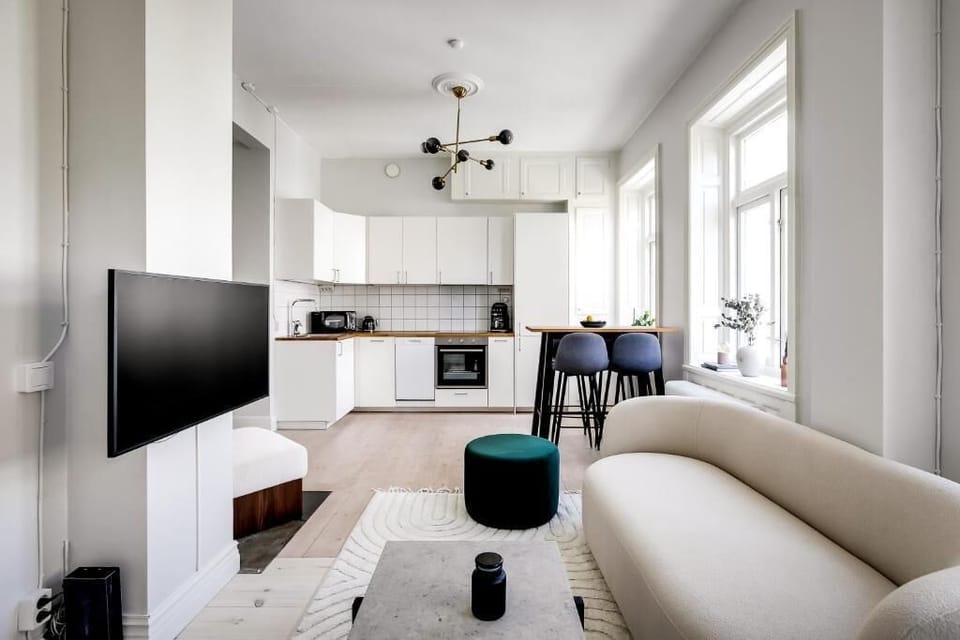 Deluxe Apartment, City View | Living area | Flat-screen TV