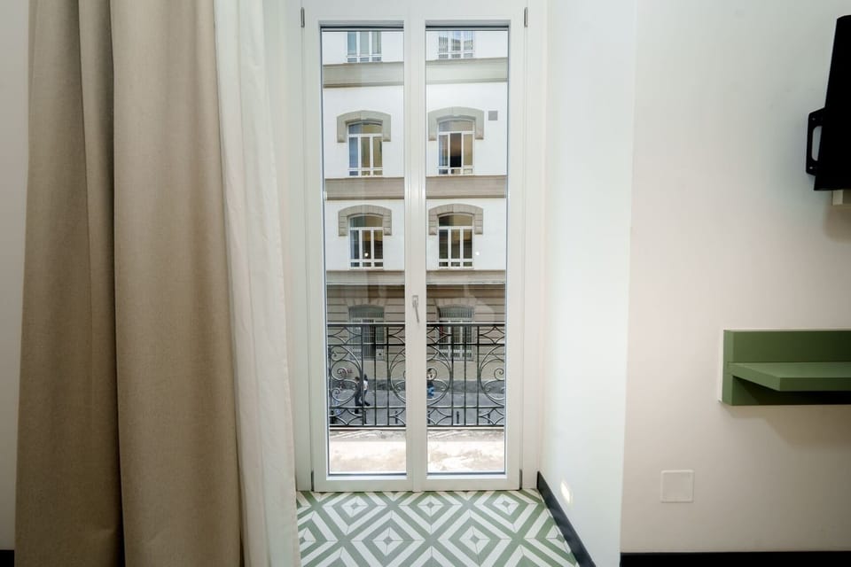 Deluxe Room, City View | In-room safe, desk, laptop workspace, soundproofing