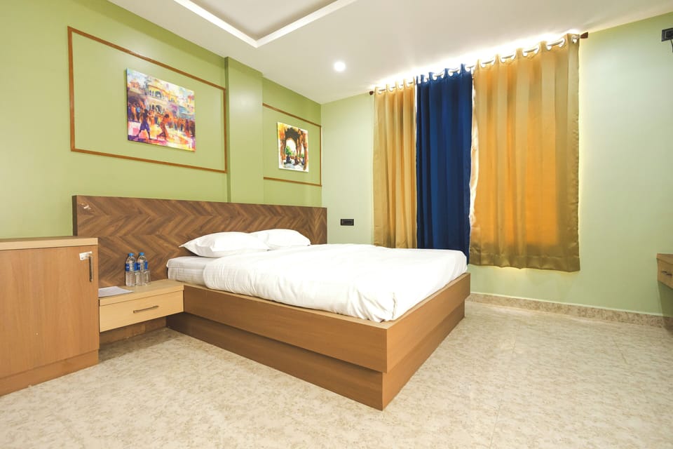 Deluxe Quadruple Room, City View | Desk, laptop workspace, free WiFi