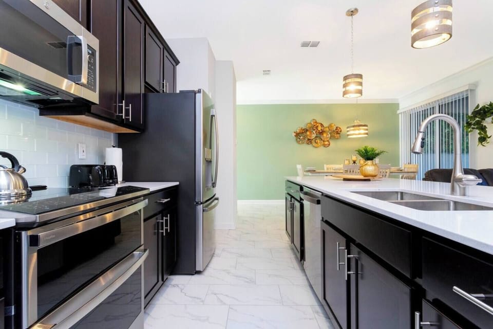 A full equipped and comfortable kitchen ready for family gatherings where you can feel as cozy as home.