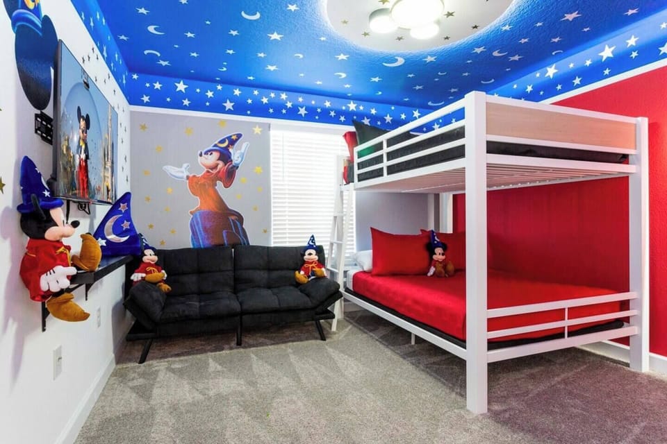 Welcome to the kids' room adorned with delightful Mickey Mouse decor and a bunk white bed with individual sized beds and Smart TV for every kids comfort! 
