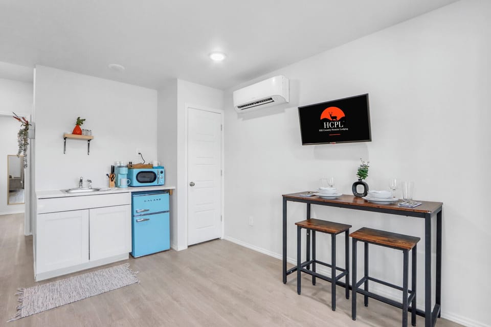 The kitchenette is conveniently located next to dining