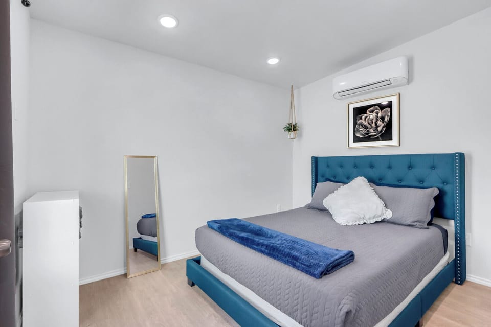 The bedroom has a queen bed