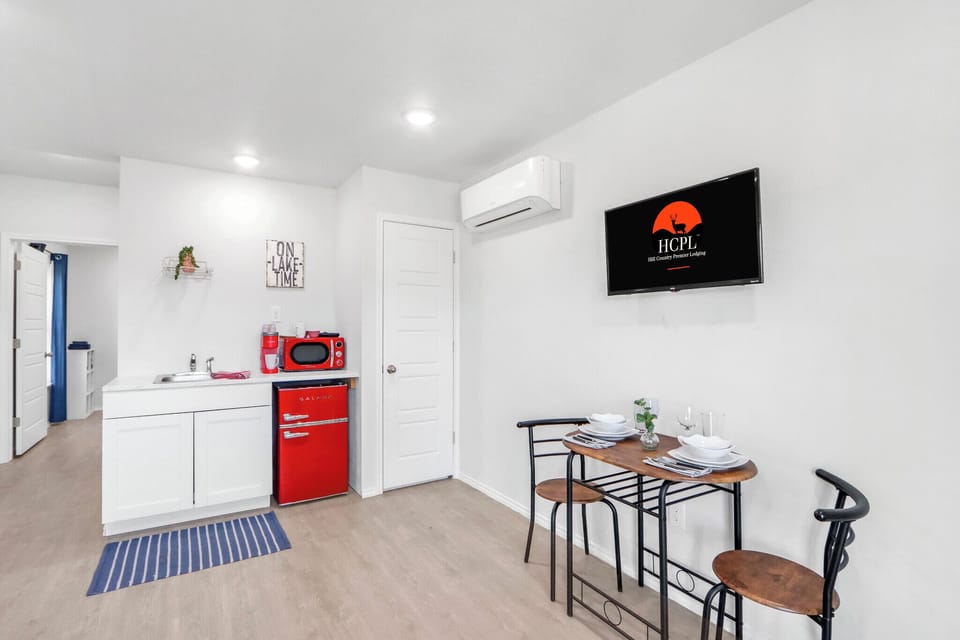 The kitchenette features bright retro appliances
