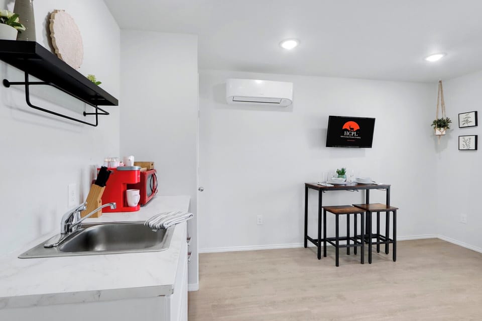 The kitchenette is conveniently located next to dining
