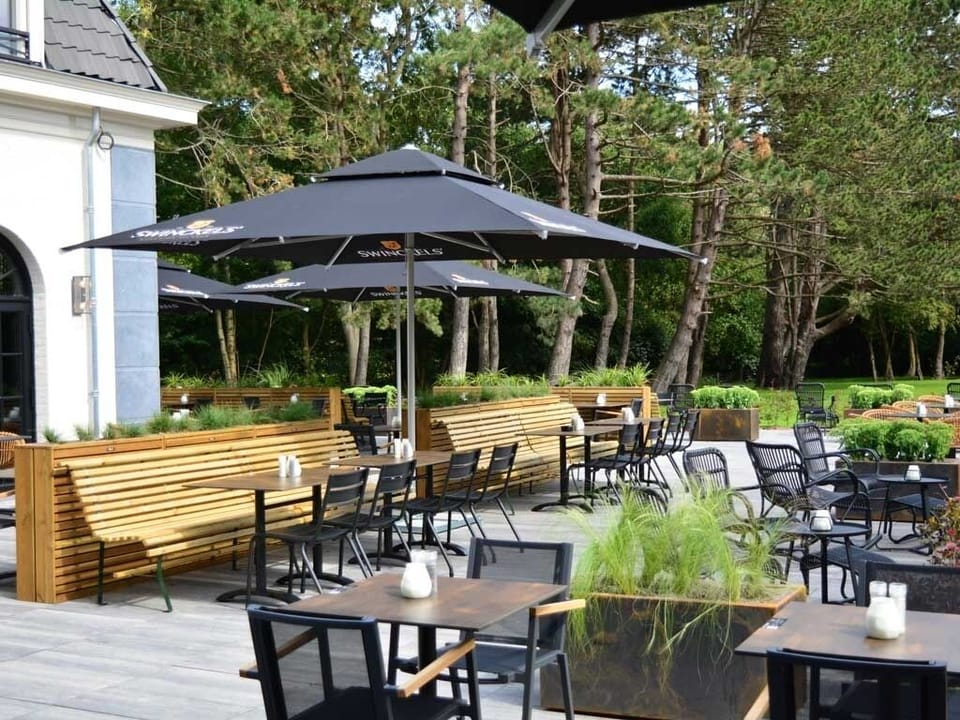 Unwind outdoors with shaded dining and peaceful garden views.