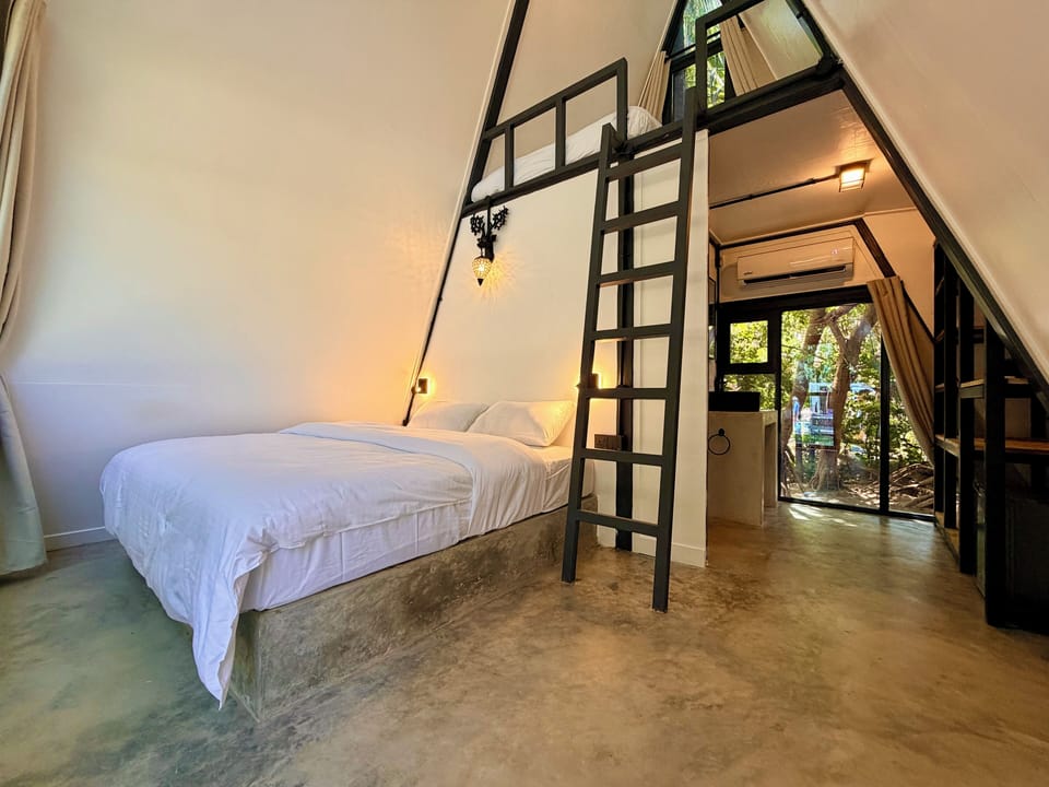 Deluxe Triple Room, Partial Sea View | In-room safe, desk, free WiFi, bed sheets