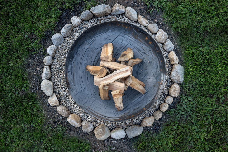 Fireplace in the garden with mountain view.