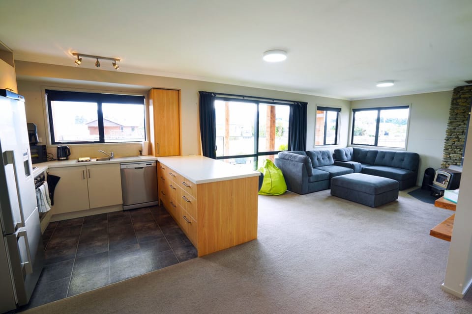 Fully equipped modern kitchen with everything needed for home cooking during your stay.