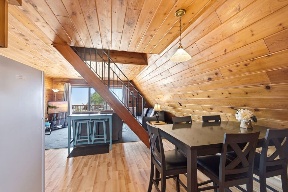 Open dining area keeps meals, games, and conversation in one shared space.