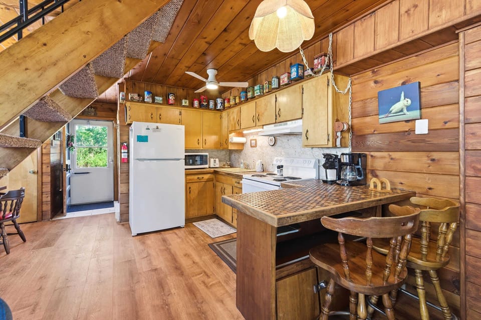 Full kitchen with seating, making meals easy between resort activities.