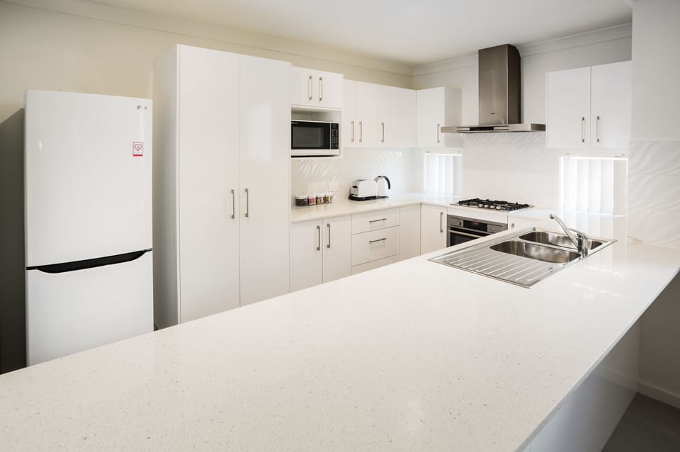 Executive Apartment, 2 Bedrooms | Private kitchen | Coffee/tea maker, full-size fridge, microwave, oven
