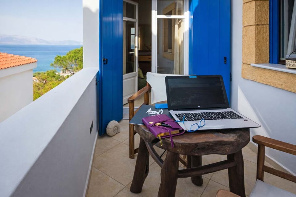 Private balcony with seating and island views