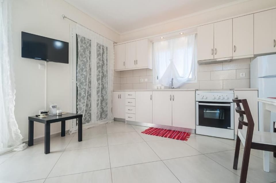 Modern living space with TV and comfortable seating.