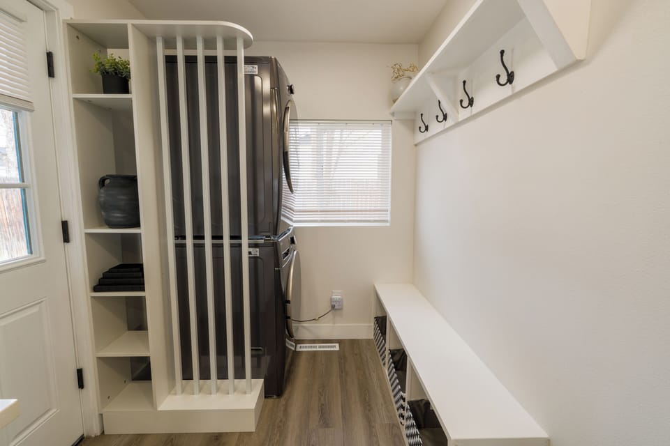Step into your organized entryway with built-in storage, coat hooks, and bench seating—perfect for settling in after your adventures.