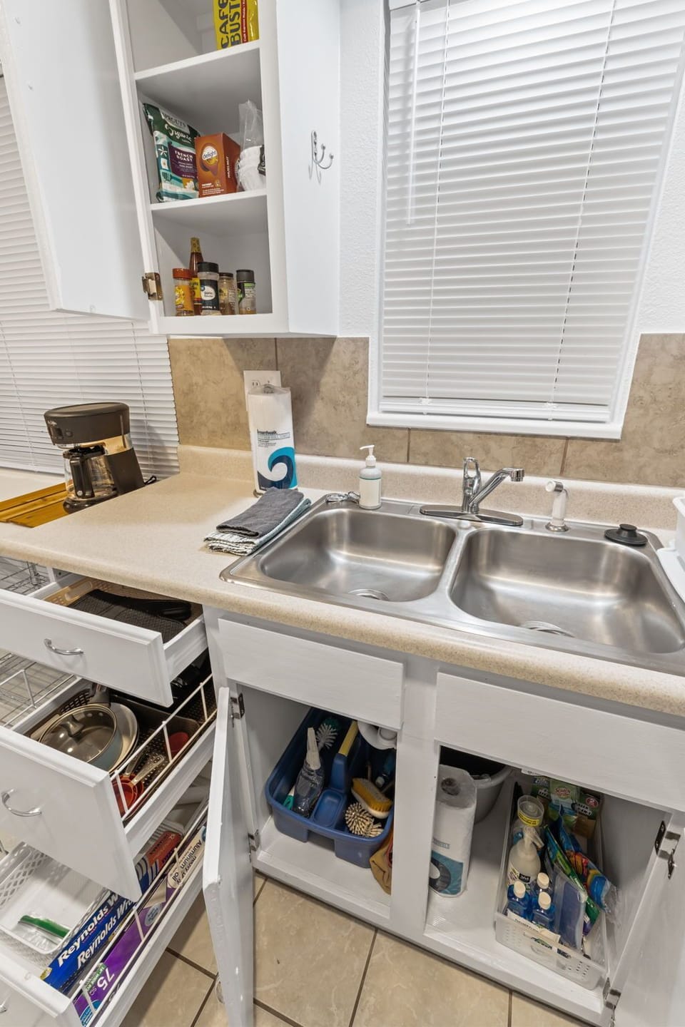 Your fully equipped kitchen awaits with everything you need to create memorable meals during your stay - from the spacious double sink to organized storage that makes cooking feel effortless.