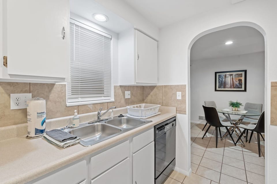 Step into your bright, fully-equipped kitchen where you'll love preparing meals with modern appliances and plenty of counter space. The adjacent dining area beckons for memorable conversations over home-cooked dinners.