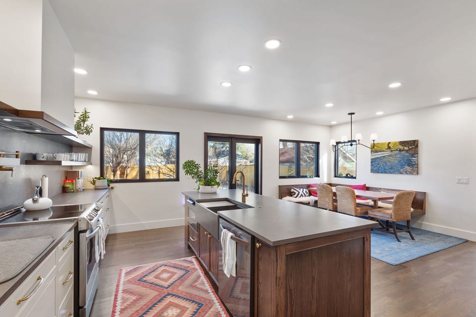 Cook together in your open-concept kitchen with warm wood tones, granite counters, and plenty of space to gather around the island.
