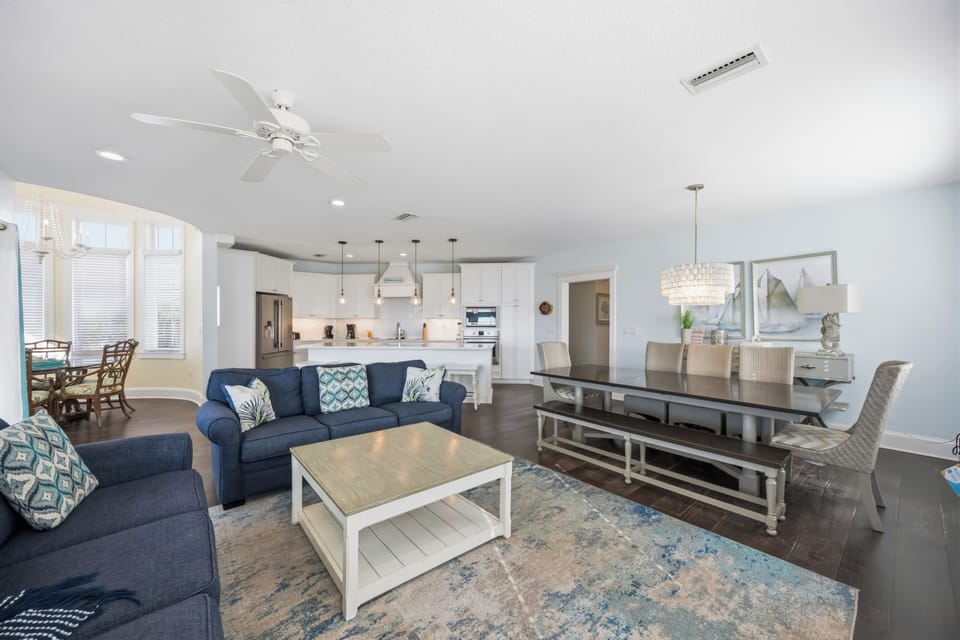 Relax in your spacious open-concept retreat with coastal-inspired furnishings, modern kitchen, and comfortable seating perfect for gathering.
