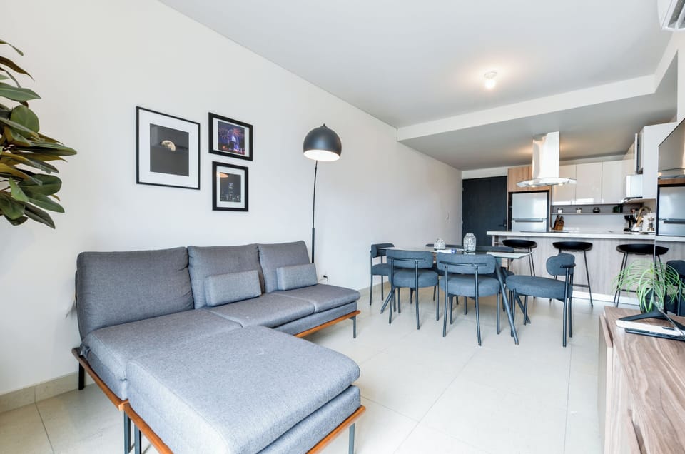 Family Suite, City View | Living area | 60-inch Smart TV with digital channels, streaming services