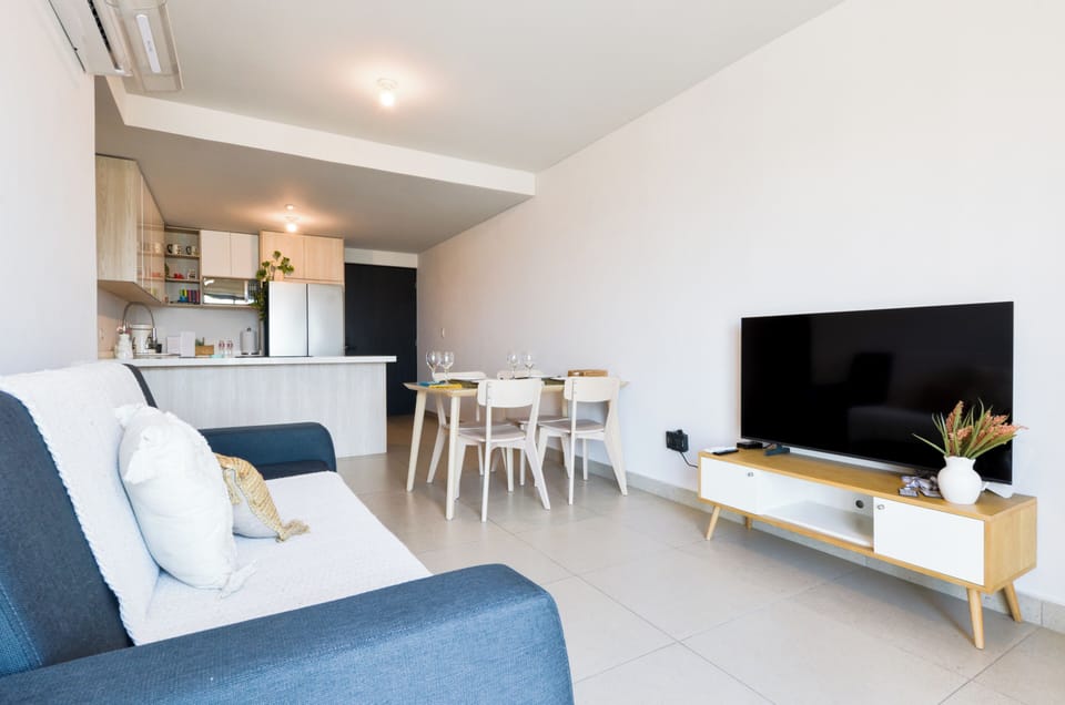 Superior Suite, Balcony, City View | Living area | 60-inch Smart TV with digital channels, streaming services