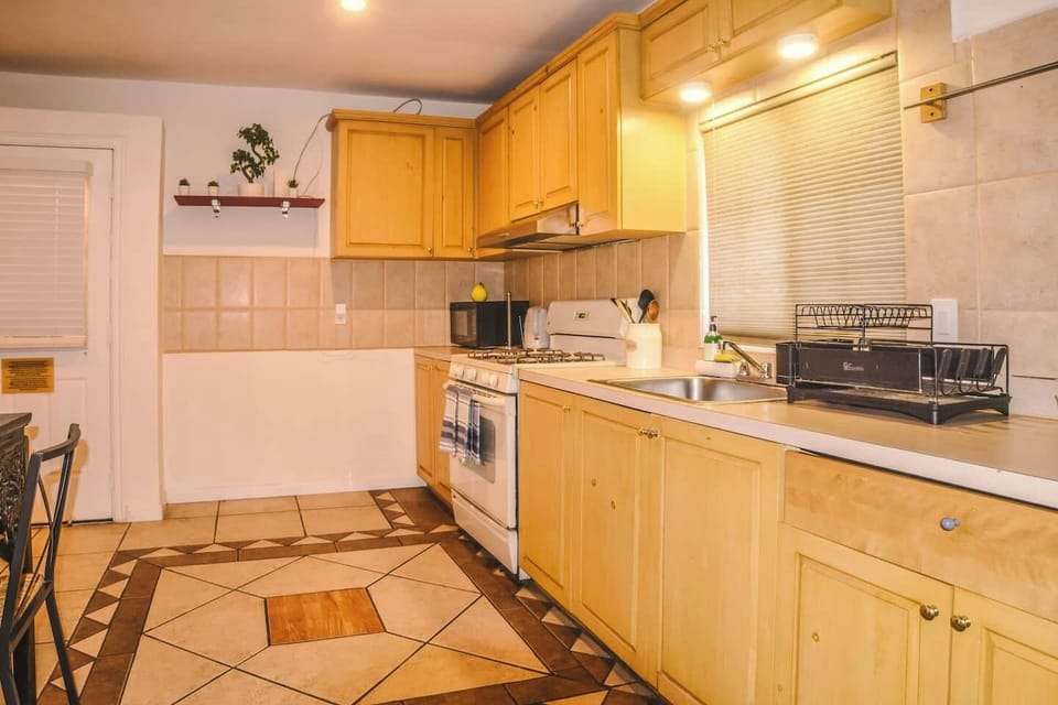 Soft lighting highlights the floor details and practical layout for comfortable meal preparation.