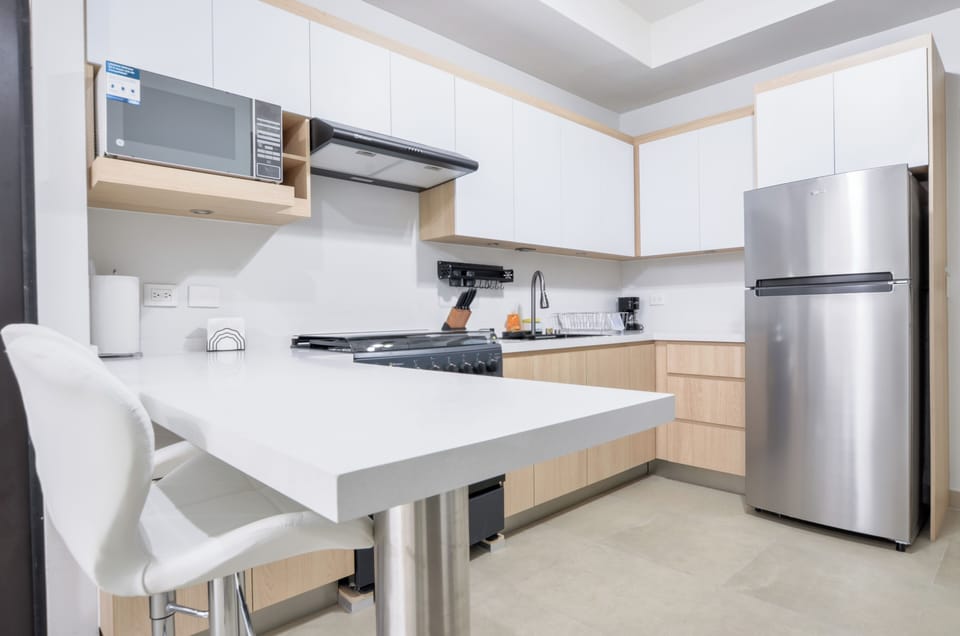 Comfort Suite, Balcony, City View | Private kitchen | Full-size fridge, microwave, stovetop, blender