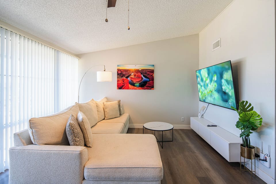Deluxe Apartment, 2 Bedrooms, Pets Allowed | Living area | 65-inch Smart TV with digital channels, streaming services